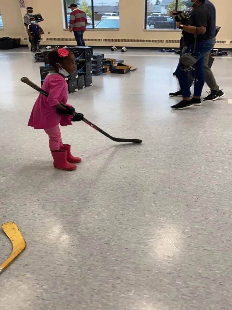 A participant with a hockey stick is ready to get into gear and hit the rink