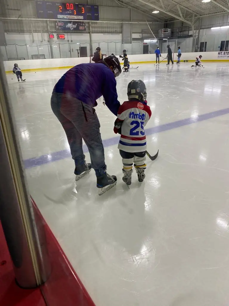 Participant learning from hockey coach